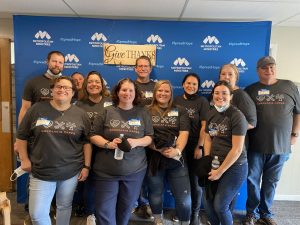 volunteers wearing kokolakis cares shirts